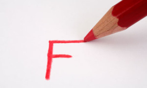 Red pencil marking an F on paper close up. Image shot 2009. Exact date unknown.
